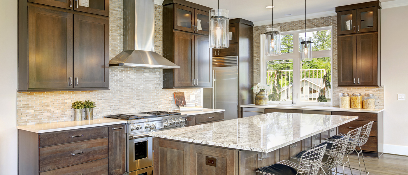 Modern kitchen with custom pendant lighting and energy-efficient fixtures installed by Ryan Electrical Solutions