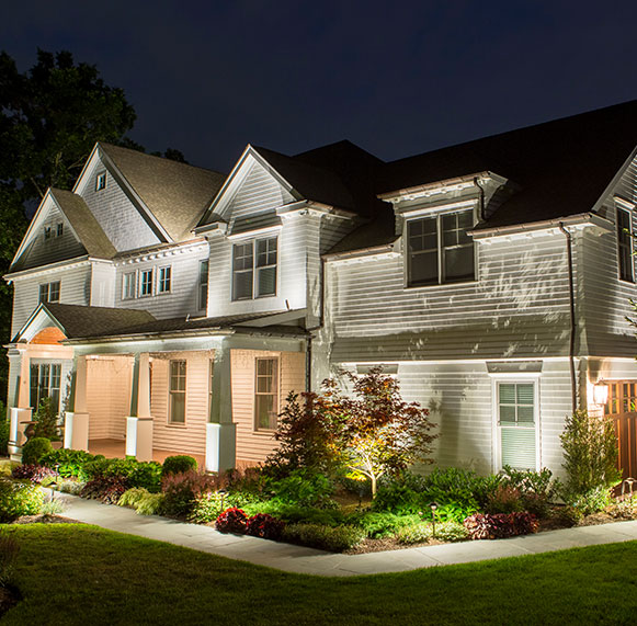 Home after dark with landscape lighting from Coastal Source