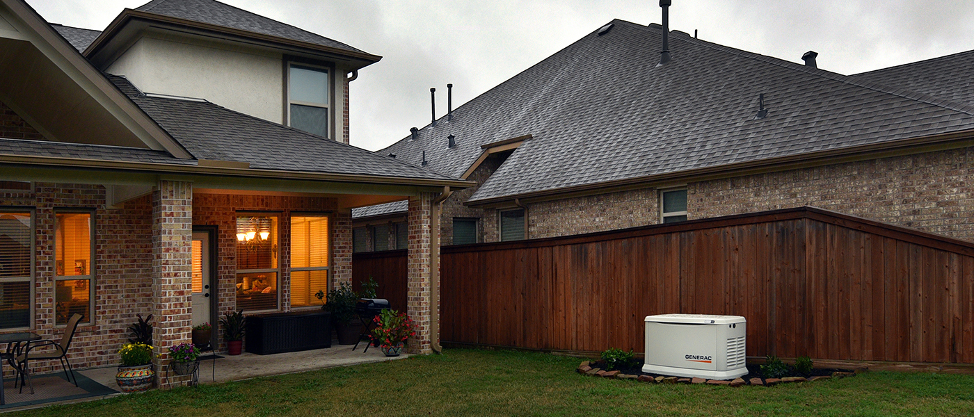 Professional residential generator installation by Ryan Electrical Solutions, Generac whole house generator in backyard of modern brick home